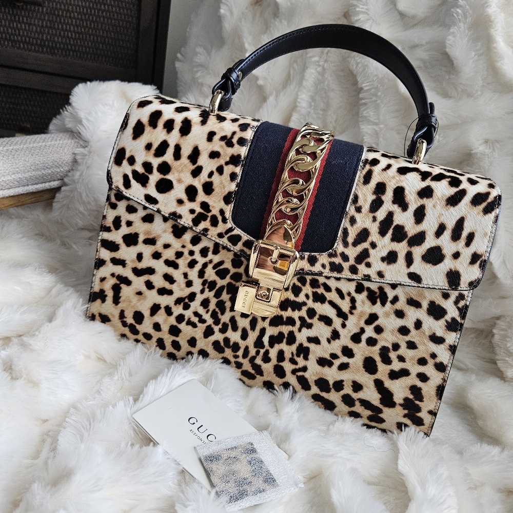 Gucci Beige/Black Leopard Print Calfhair and Leather Sylvie Top Handle Bag. Bran